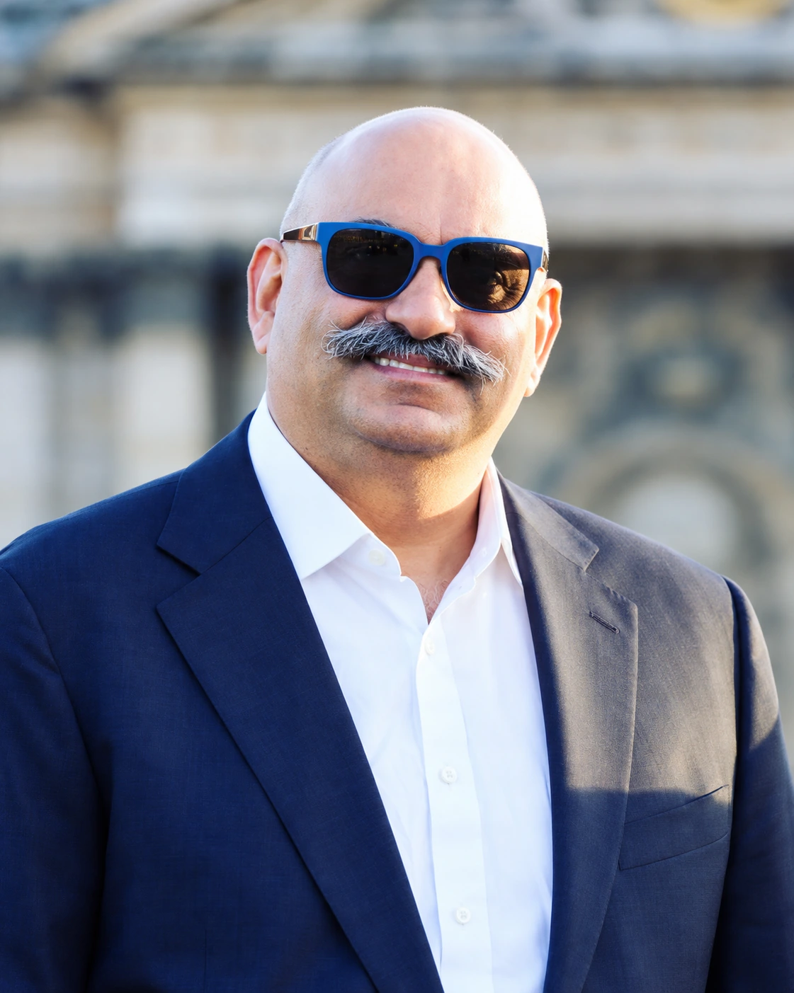 Mohnish Pabrai — Licensed original color photograph, cropped and AI enhanced